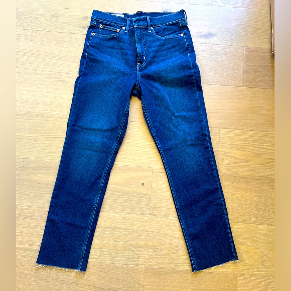 NWOT slim dark wash jeans! Fun gently frayed hem.